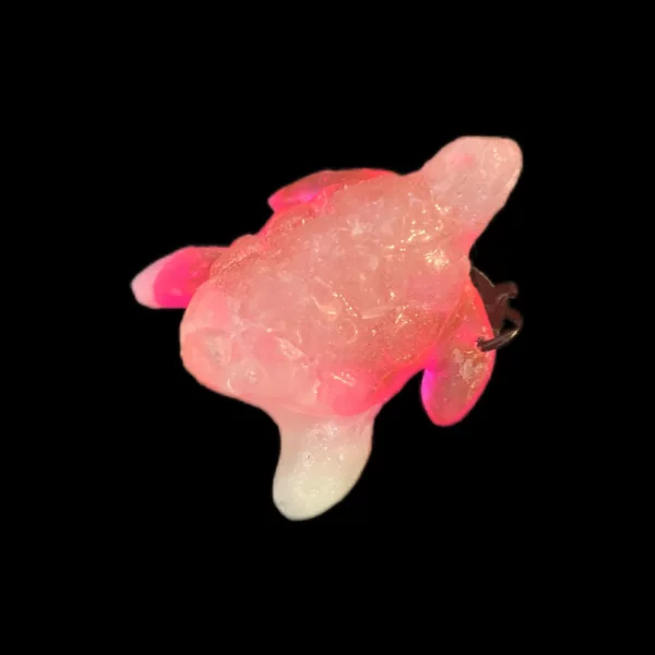 Tortue sur le coté rose et blanc